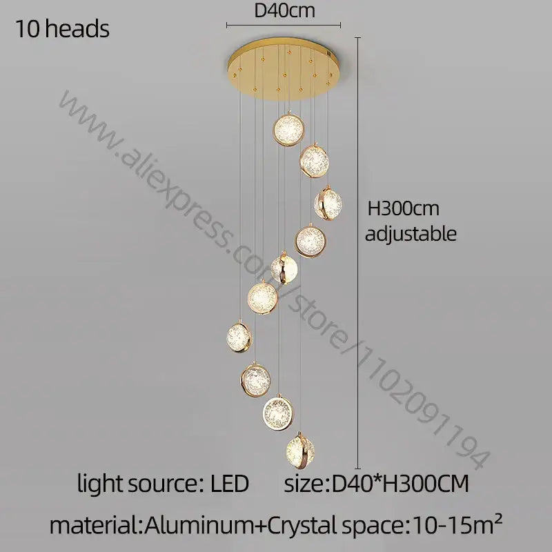 Gold-toned modern crystal ball chandelier with ten spherical crystal-encrusted light heads on aluminum base