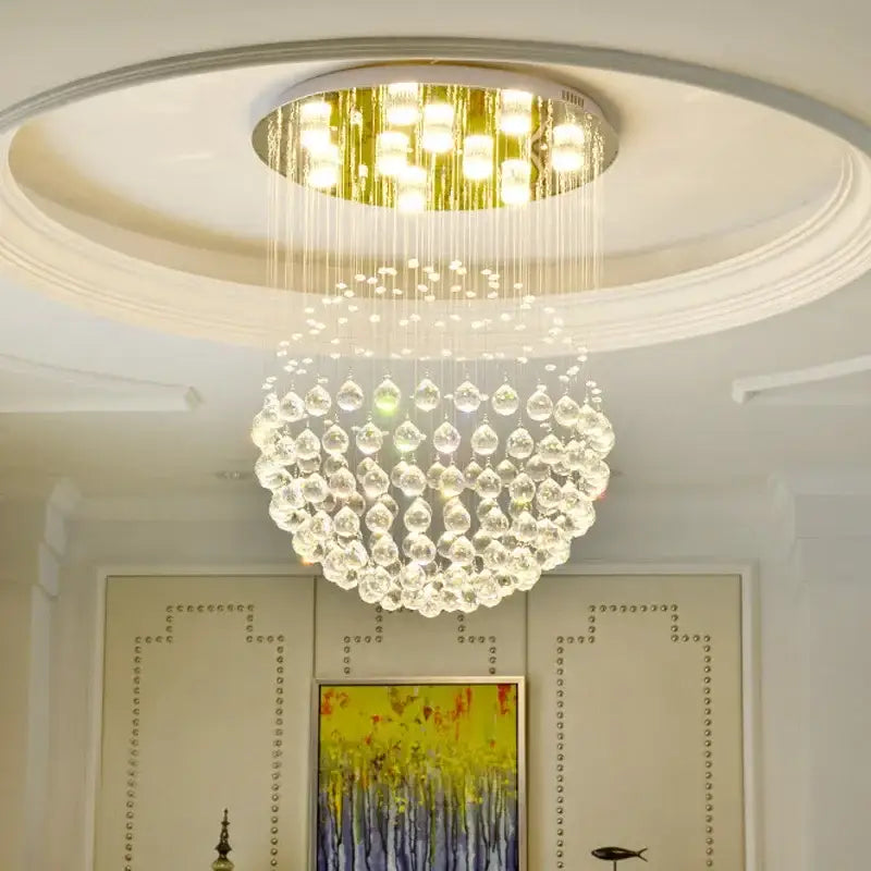 Modern gold crystal ball led chandelier with circular gold fixture and cascading clear teardrop crystals for dining room decorbites crystal ball led