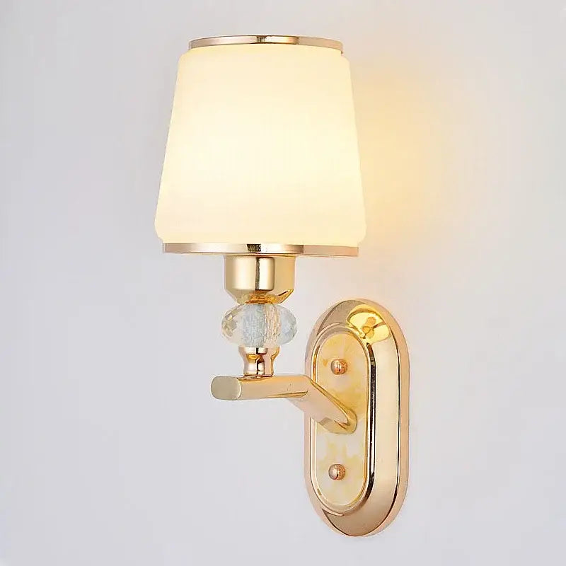 Modern gold crystal bedside wall sconce with frosted glass shade and ornate crystal accent for bedroom decorbites crystal bedside