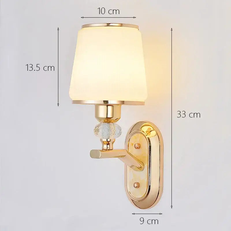 Modern gold crystal bedside wall sconce with frosted glass shade and crystal accent for bedroom decorbites crystal bedside