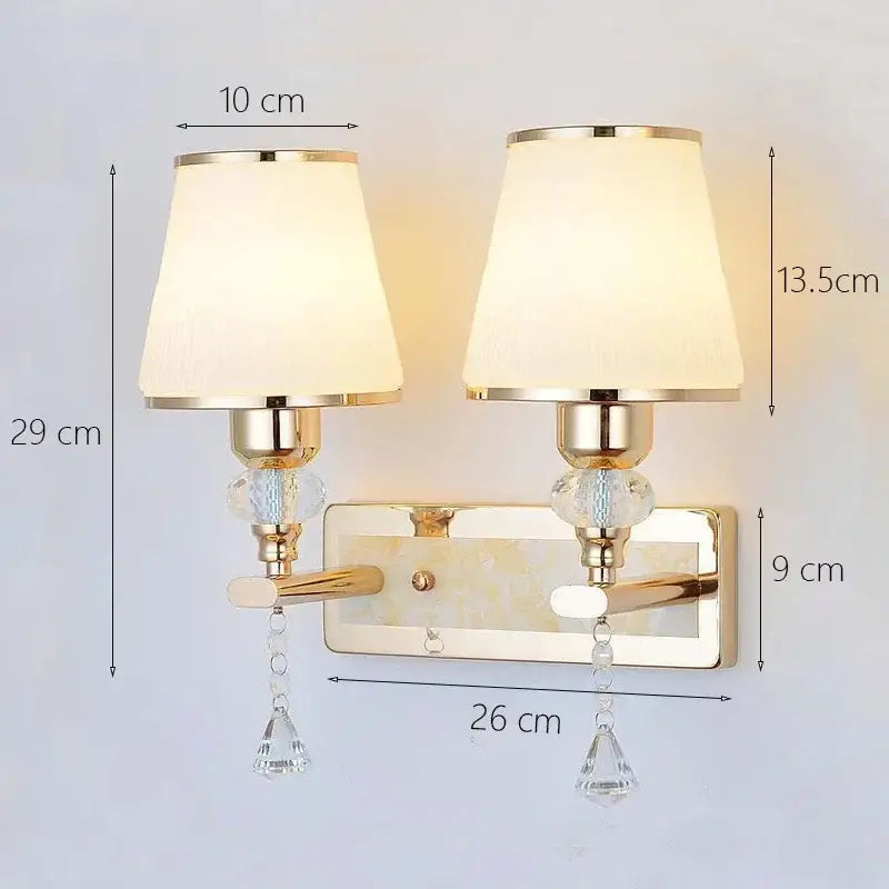Modern gold crystal bedside wall sconce with cream fabric shades and decorbites crystal bedside droplets for bedroom light