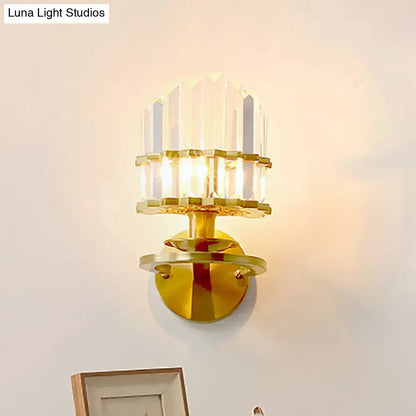 Gold-toned wall lamp with stacked faceted crystal block tiers designed for modern living room lighting sconce
