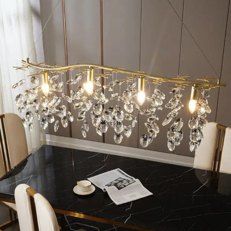 Modern gold crystal branch pendant chandelier featuring gold-toned branches and dangling crystal droplets for dining room decorbites crystal branch lighting