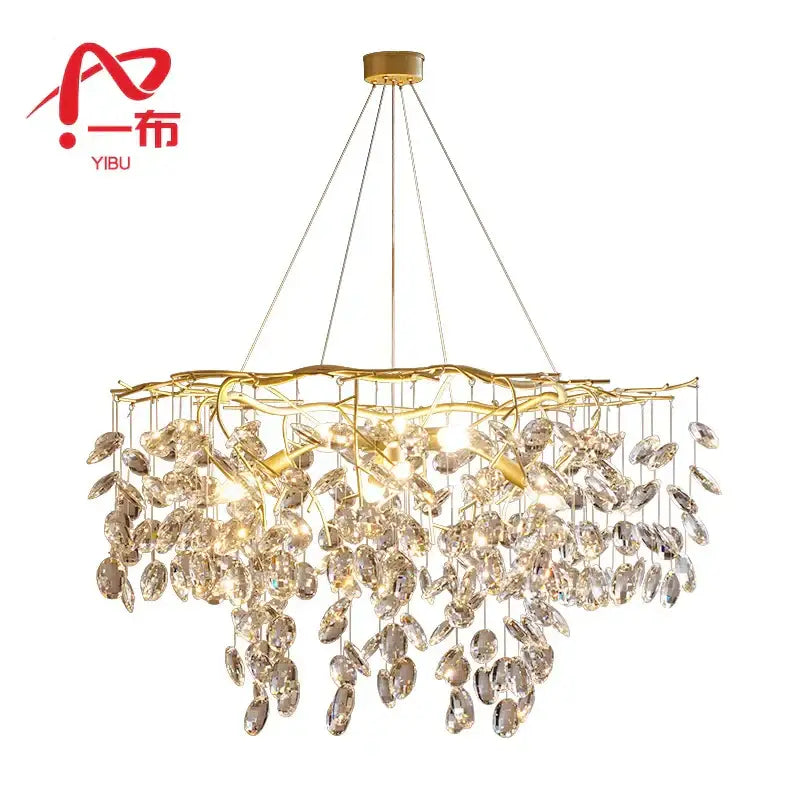 Modern gold crystal branch pendant chandelier featuring cascading crystal leaves on a branching metal frame for dining room decorbites crystal branch light