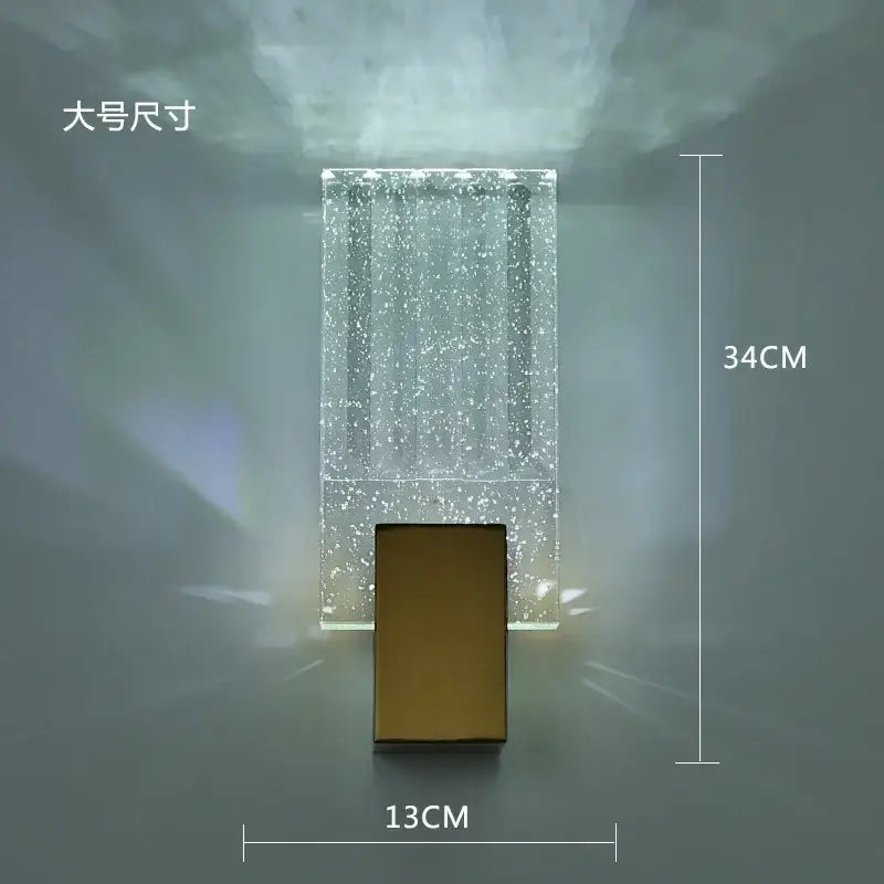 Modern gold crystal brass led wall lamp with a clear acrylic body and sleek metal base for luxury decorbites crystal brass decor