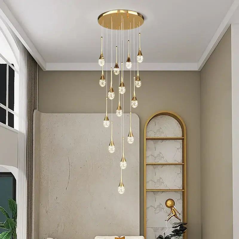 Modern gold crystal bubble chandelier with multiple teardrop crystal pendants by decorbites for dining room decor