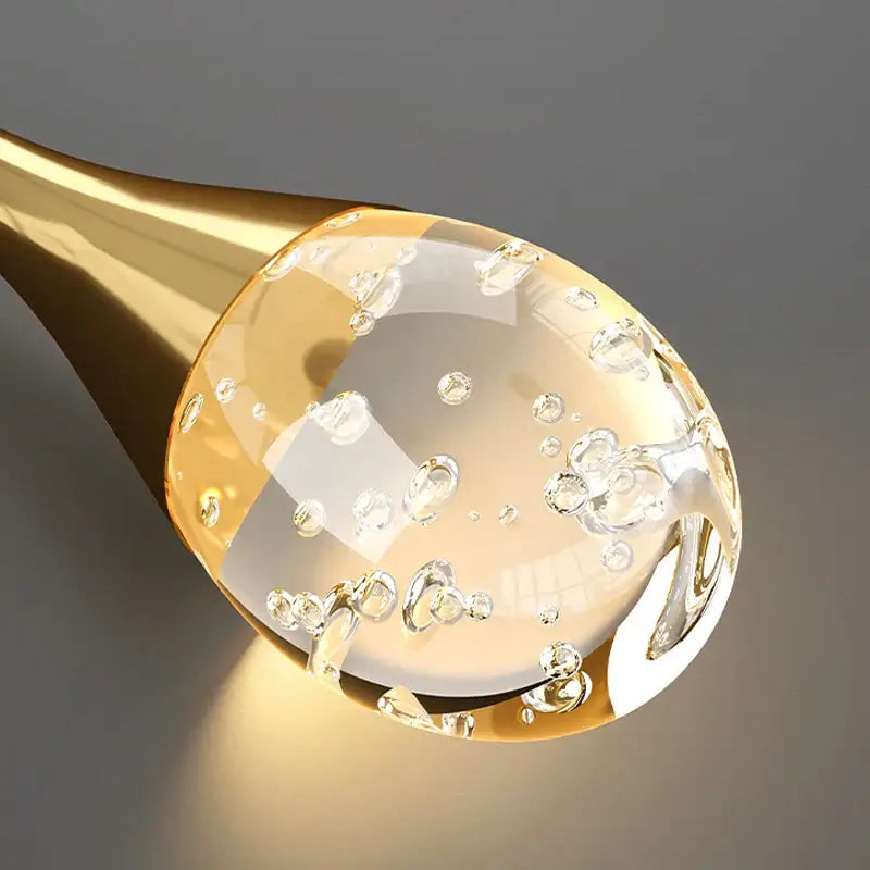 Modern gold crystal bubble chandelier teardrop pendant with golden spoon-shaped dropper and clear golden liquid bubbles decorbites crystal bubble