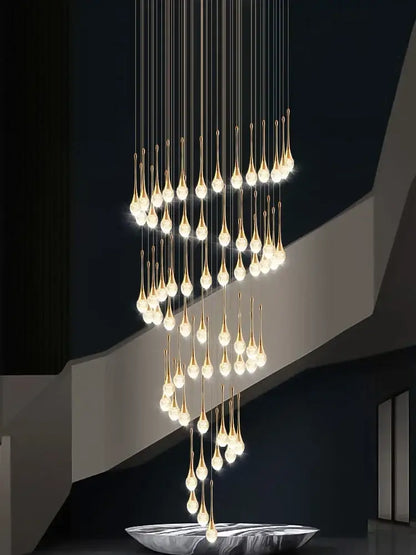 Modern gold crystal bubble chandelier with teardrop pendant and warm glowing lights above a sleek silver bowl decorbites crystal bubble