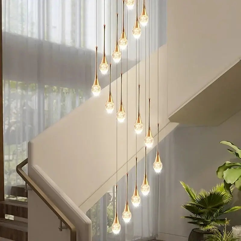 Modern gold crystal bubble chandelier with teardrop glass shades in a cascading decorbites crystal bubble design