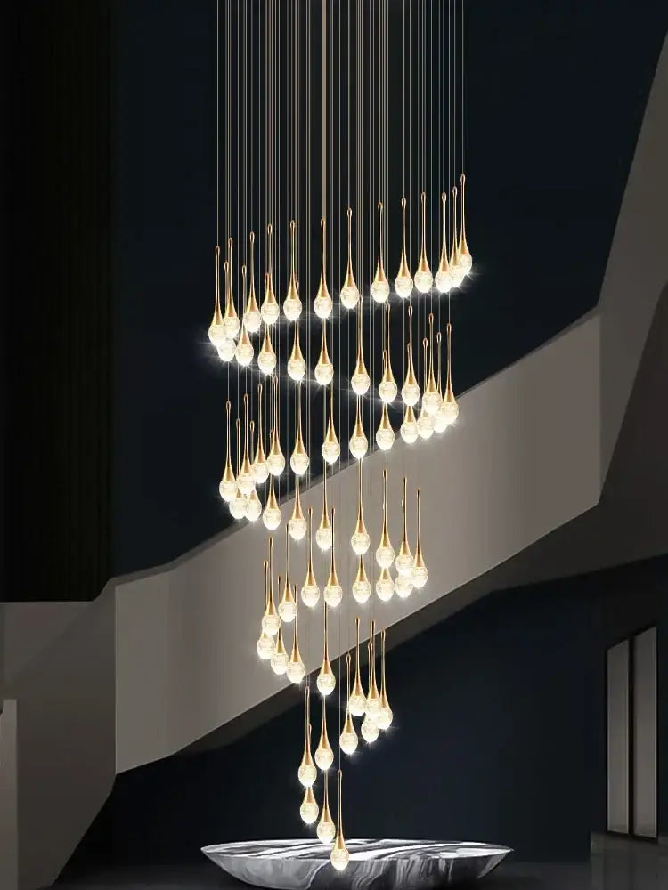 Modern gold crystal bubble chandelier teardrop pendant with warm lights above sleek silver bowl decorbites crystal bubble