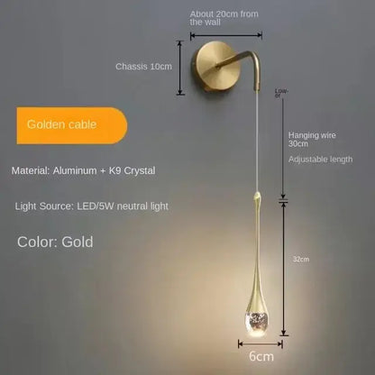 Modern gold crystal bubble pendant chandelier featuring a sleek teardrop crystal bubble pendant on adjustable aluminum cable