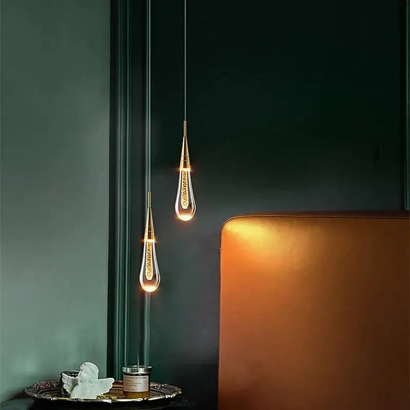 Two elegant gold crystal bubble pendant lights with clear glass and warm filament glow for dining room decorbites crystal bubble