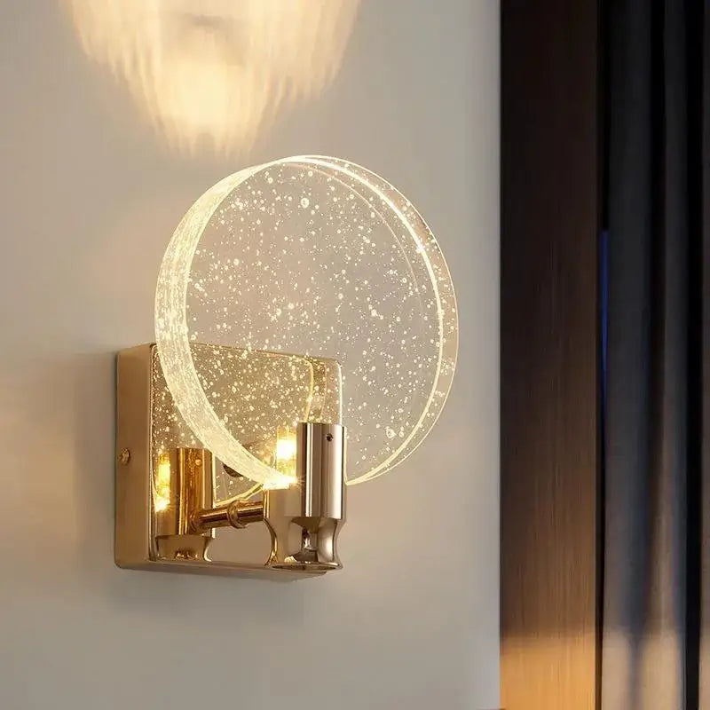 Modern gold crystal bubble wall lamp with a circular translucent glass shade and brushed gold bracket for luxury decorbites lighting