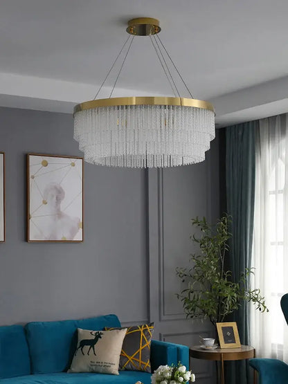 Modern gold crystal ceiling chandelier with a circular frame and cascading clear strands pendant light for dining room decorbites crystal ceiling