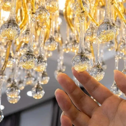 Modern gold crystal ceiling chandelier with intricate teardrop-shaped crystal droplets for decorbites crystal decor