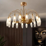 Modern gold crystal ceiling fan lights featuring a gold-toned chandelier with clear faceted glass shades in a radial pattern