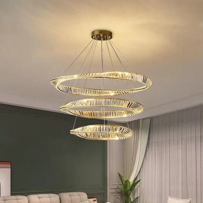 Modern gold crystal ceiling pendant light featuring a golden spiral design and crystal accents for living rooms