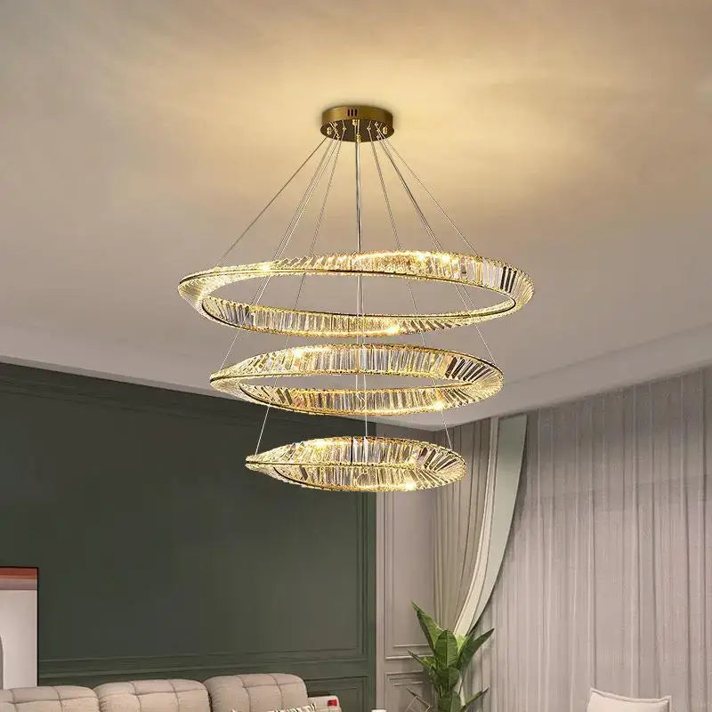 Modern gold crystal ceiling pendant light featuring a golden spiral design and crystal accents for living rooms