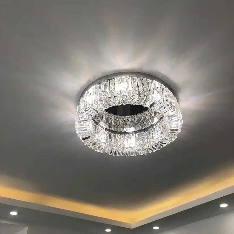 Modern gold crystal chandelier with sleek chrome frame and clear faceted crystals ideal as a ceiling light decorbites elegant gold