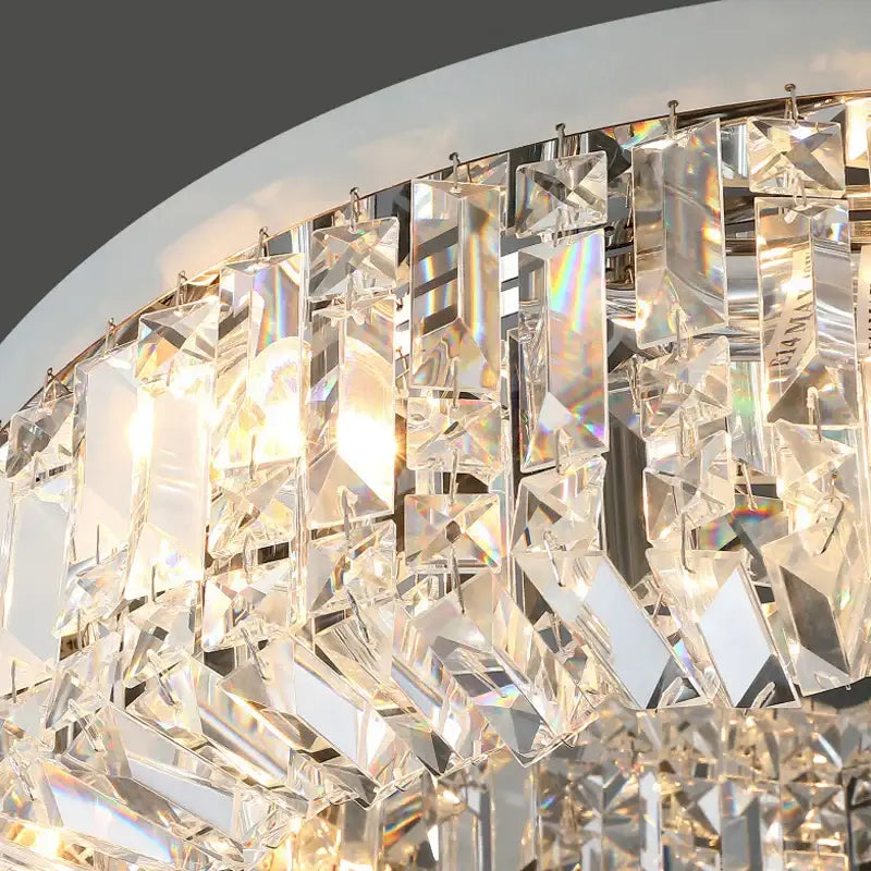 Modern gold crystal chandelier ceiling light with curved design and cascading faceted prisms by Decorbites elegant gold