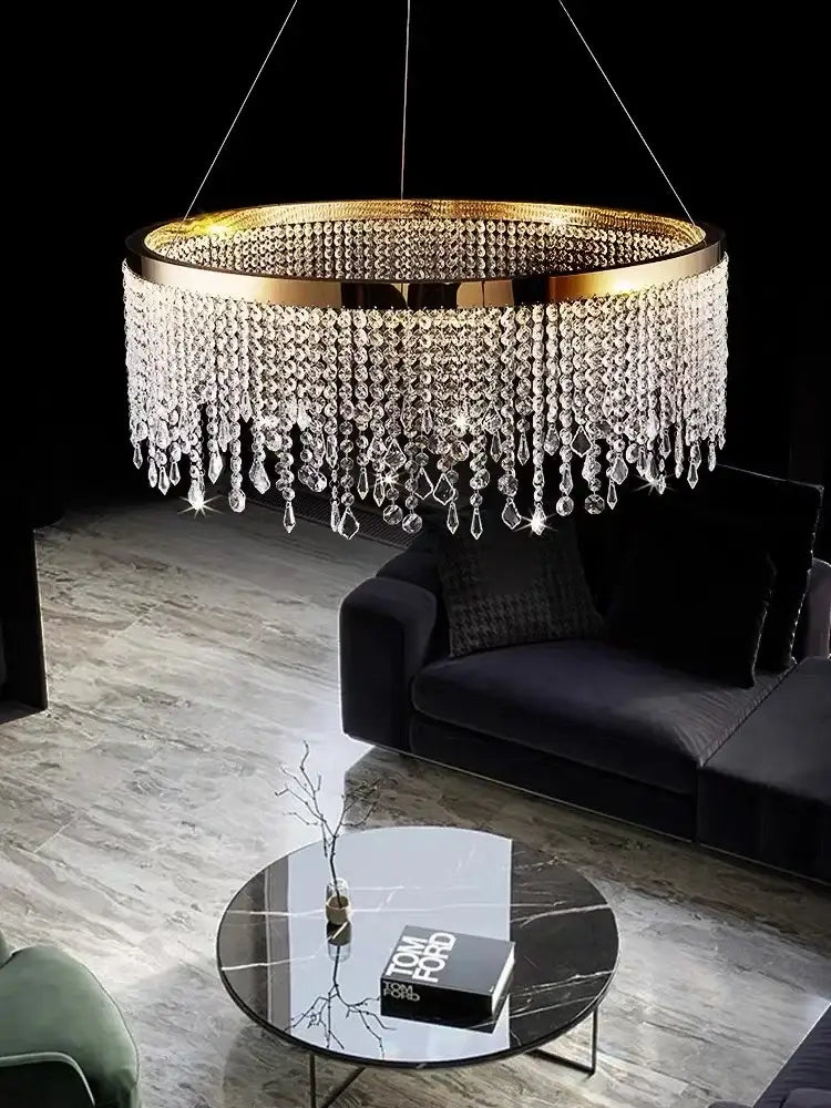 Modern gold crystal chandelier lighting fixture featuring cascading clear crystal droplets for elegant dining room decorbites decor
