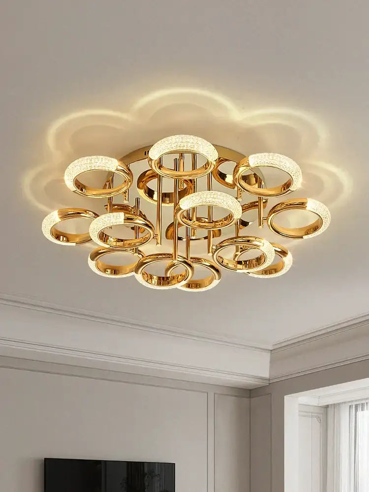 Modern gold crystal circle ring led ceiling light fixture with multiple sparkling crystal-embedded circular rings for bedroom