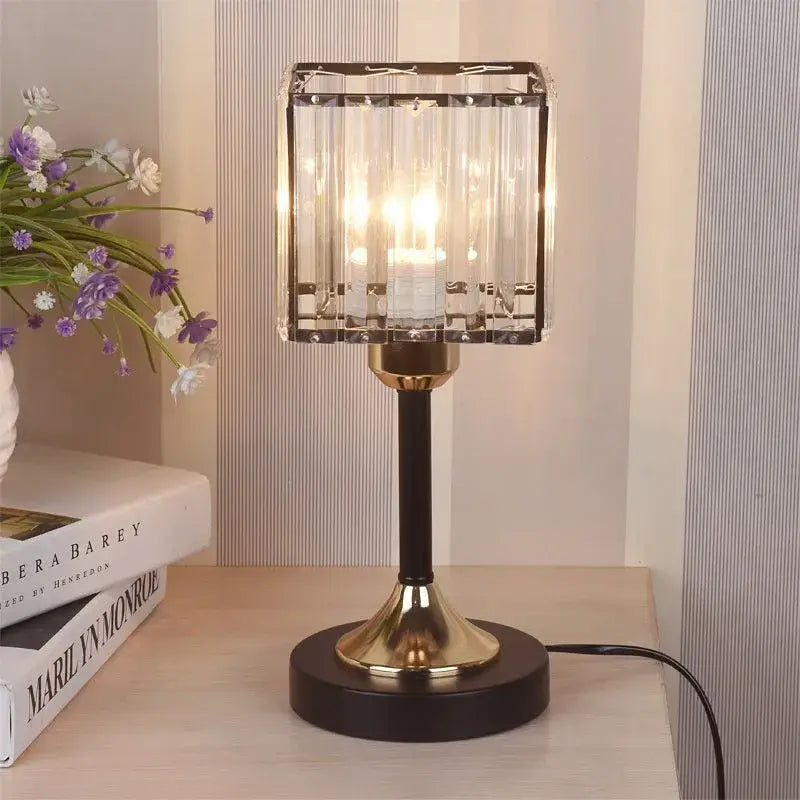 Elegant decorbites crystal desk lamp with brass finish, rectangular crystal shade, black stem, and warm USB lighting