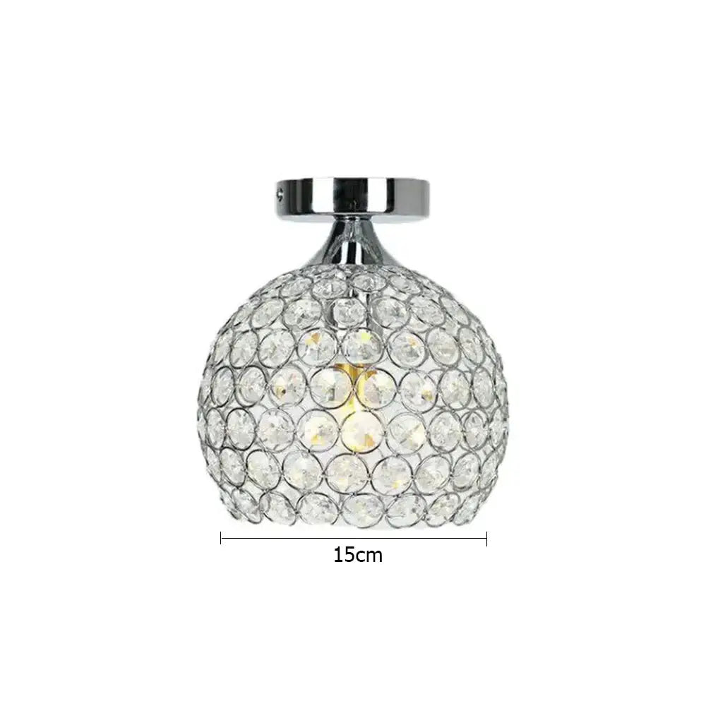 A sleek 15cm crystal diamond ceiling light with clear faceted crystals and polished chrome base for dining room use