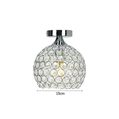 A sleek 15cm crystal diamond ceiling light with clear faceted crystals and polished chrome base for dining room use