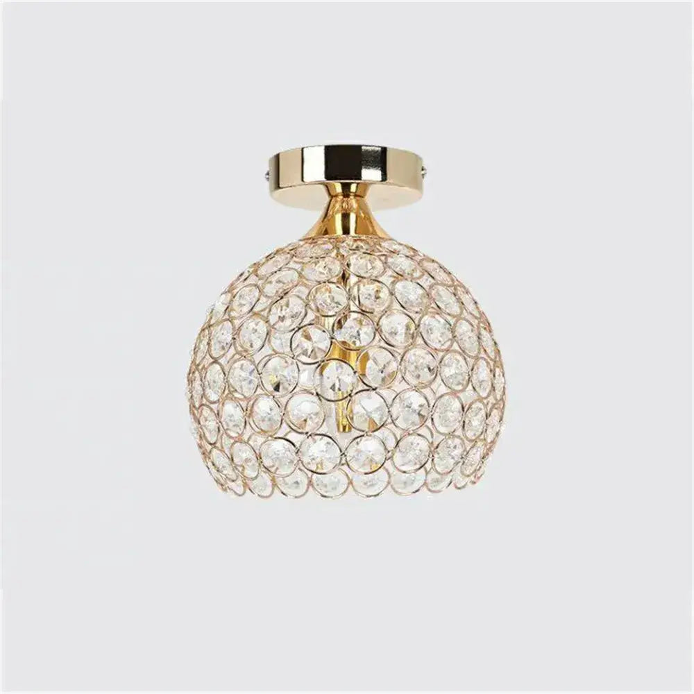 A modern gold crystal diamond ceiling light with clear faceted crystals for dining room ceiling light decor