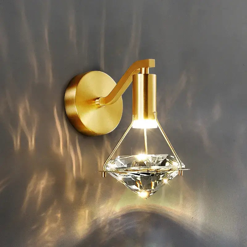 Modern gold crystal diamond wall lamp featuring a gold-finished wall sconce with a decorbites crystal diamond pendant