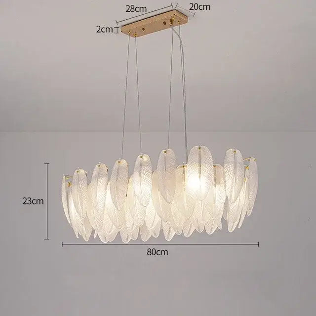 Modern gold crystal feather chandelier featuring an elegant white feather-shaped glass pendant with a gold ceiling mount