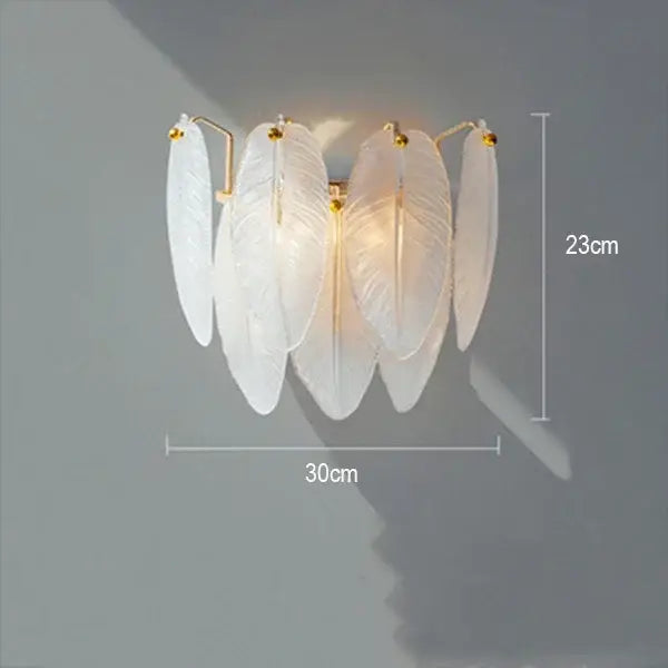 Elegant white feather-shaped wall sconce with gold-toned accents for decorbites crystal feather chandelier lighting