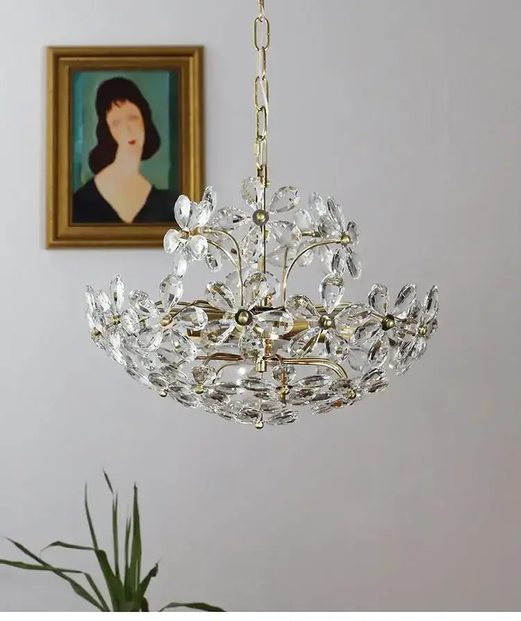 Modern gold crystal flower pendant chandelier with brass accents and multi-tiered glass pieces for living room decor