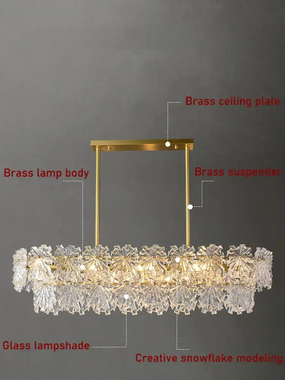 Modern gold crystal glass led pendant dining room chandelier with a gold-toned brass frame and snowflake glass led lampshades