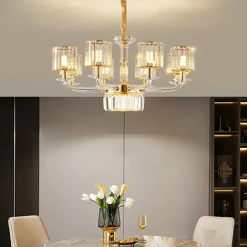 A modern gold pendant lamp with crystal glass prisms and illuminated cylindrical shades for dining room decorbites crystal glass