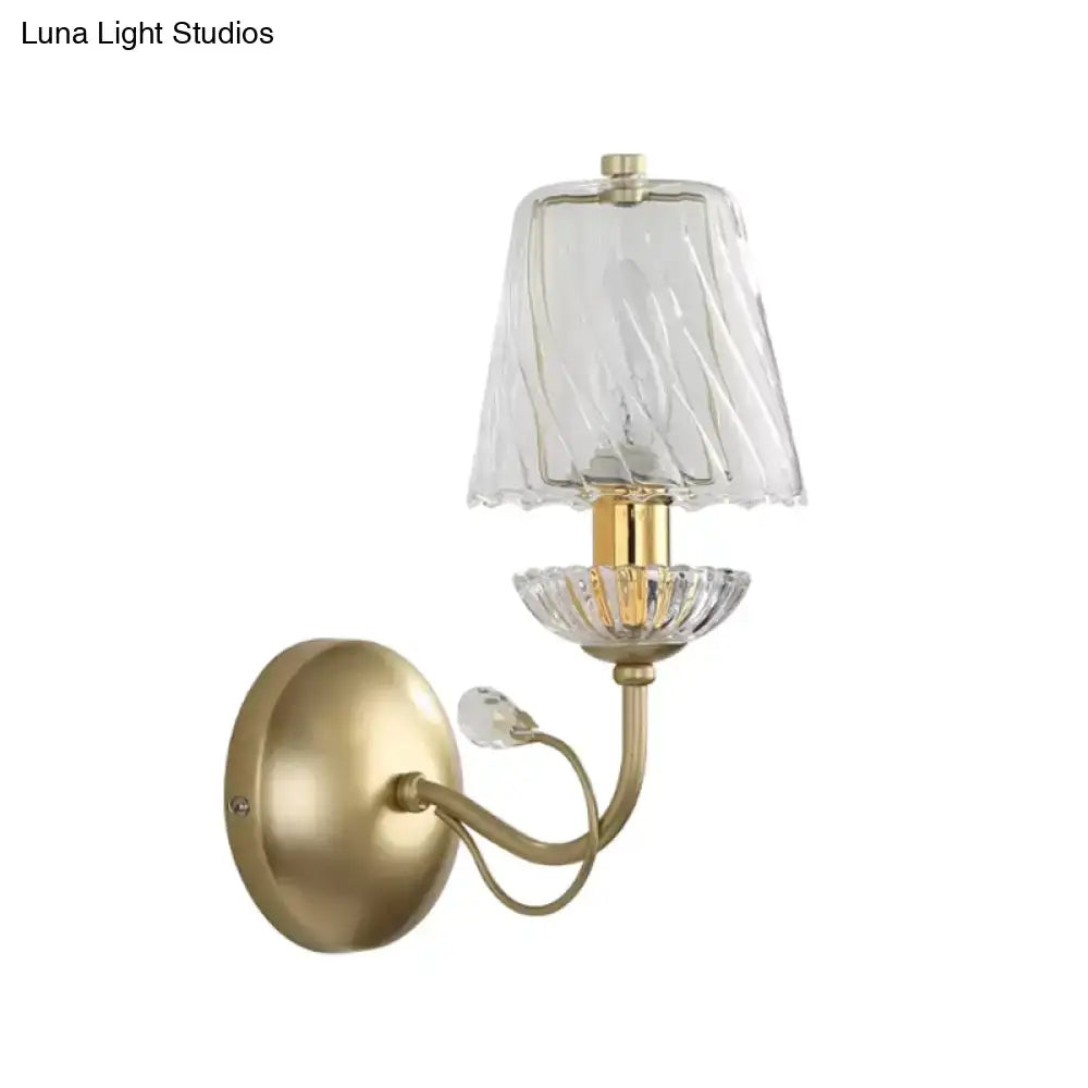 Modern gold crystal glass sconce featuring a vintage-style brass wall lamp with twisted glass shade and crystal accents