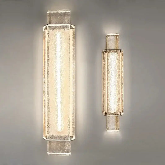 Two modern gold wall lamps with crystal glass shades featuring a warm glow for bedroom wall lights