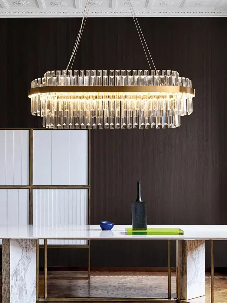 Modern gold crystal hanging lamp with a circular frame and clear crystal prisms perfect for living room decorbites crystal hanging