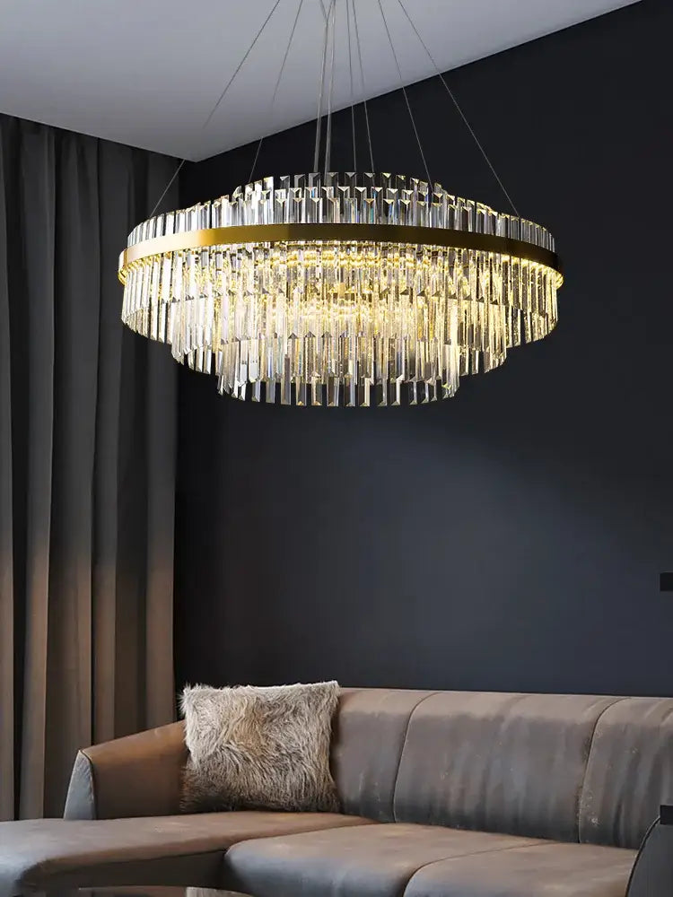 Modern gold crystal hanging lamp with a circular metal frame and clear prisms for living room decorbites crystal hanging