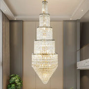 Modern gold crystal hollow long chandelier with tiered conical design and gold-toned metal accents for villa hall lighting