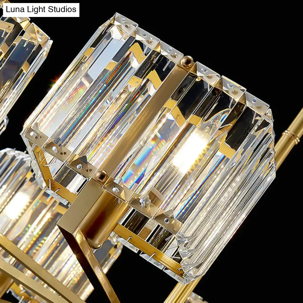 Modern gold crystal island light fixture with six faceted prisms in polished metal frames for dining room use
