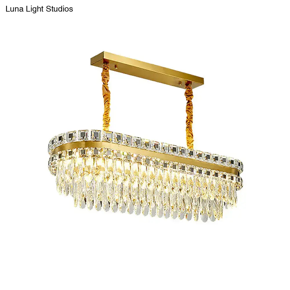 Gold-toned rectangular decorbites™ island light with clear crystal squares and teardrop crystals, compatible with 110v-120v and 220v-240v