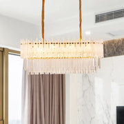 DecorBites minimalist 9-light rectangular chandelier with clear glass rods and gold accents for dining room island lighting