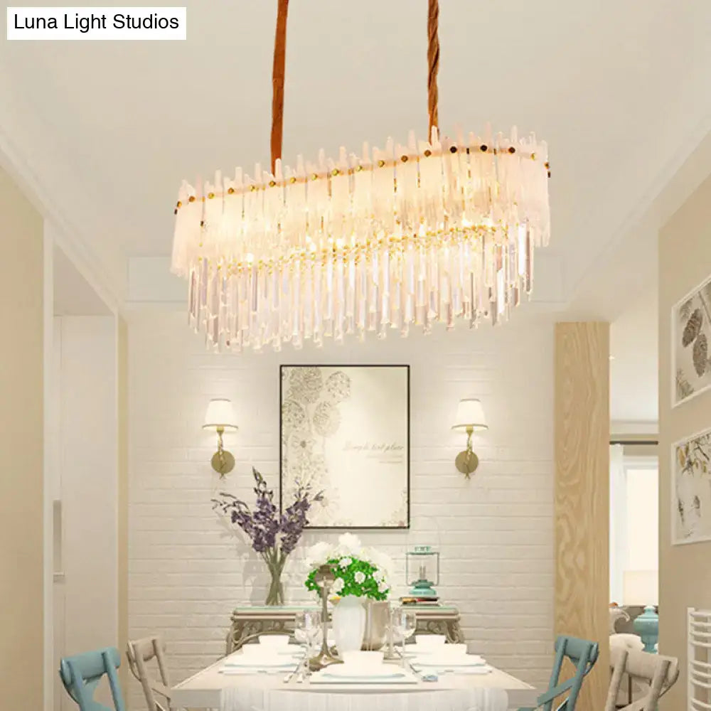 DecorBites minimalist 9-light crystal chandelier with clear prisms and gold accents for dining room island lighting