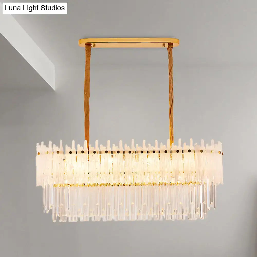 Gold-toned rectangular decorbites™ 9-light crystal chandelier with clear glass prisms and twisted rope cords for dining room island lighting
