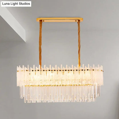Gold-toned rectangular decorbites™ 9-light crystal chandelier with clear glass prisms and twisted rope cords for dining room island lighting