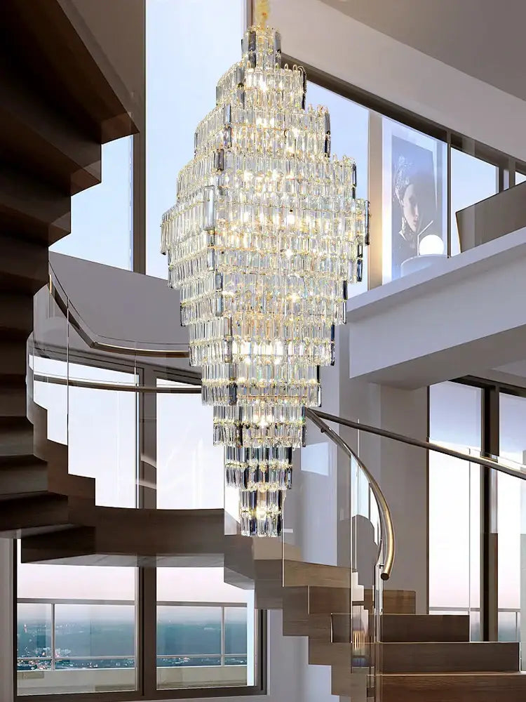Modern gold afralia crystal large chandelier with cascading rectangular prisms above living room stairs