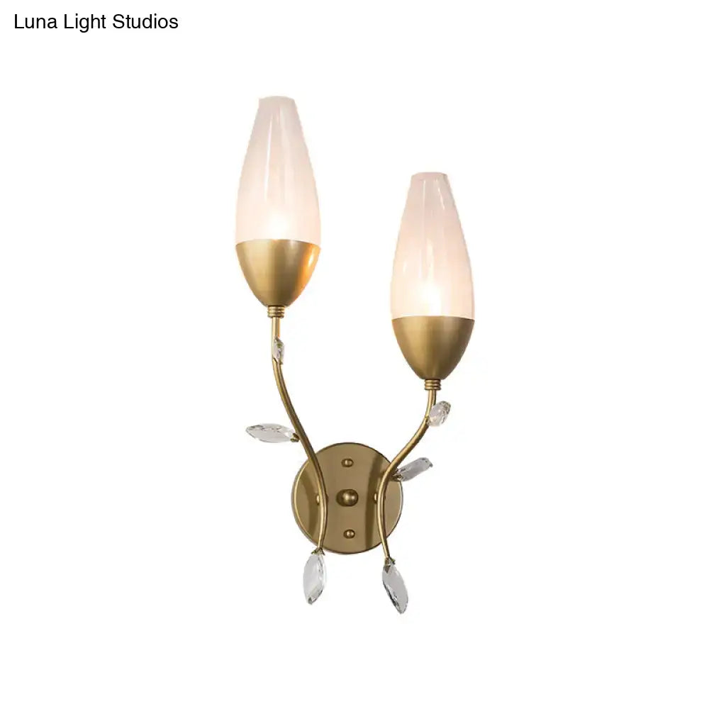 Modern gold crystal leaf wall sconce with brass finish, frosted glass shades, and crystal leaf design for bedroom lighting