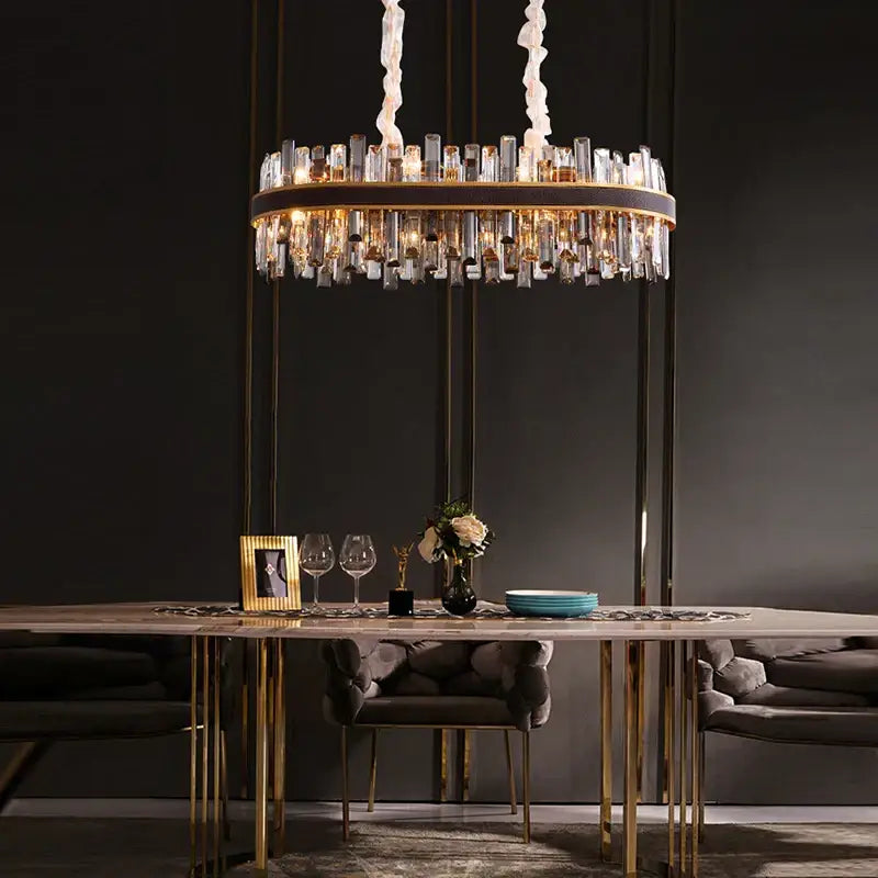 Modern gold crystal leather chandelier with circular frame and hanging glass bottles by decorbites crystal leather